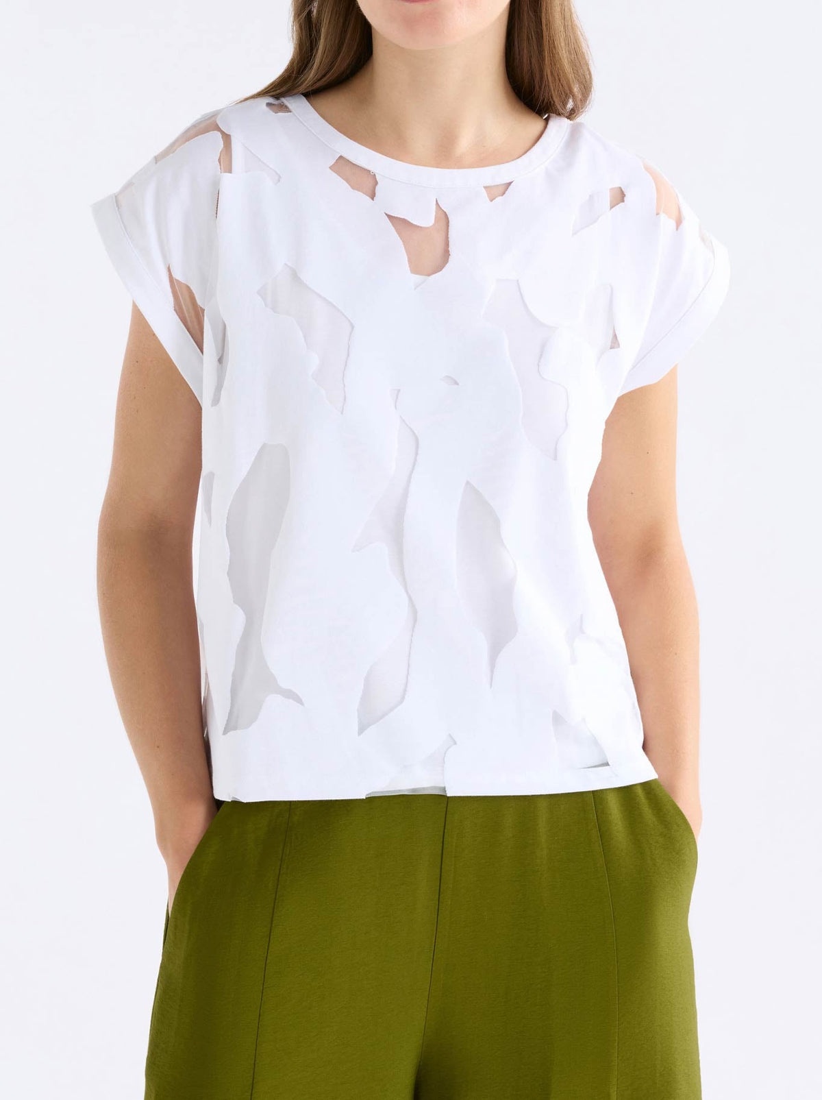 Image of a model wearing Tops. Product name - ELK VARR BURNOUT TOP in White colour by brand - Elk