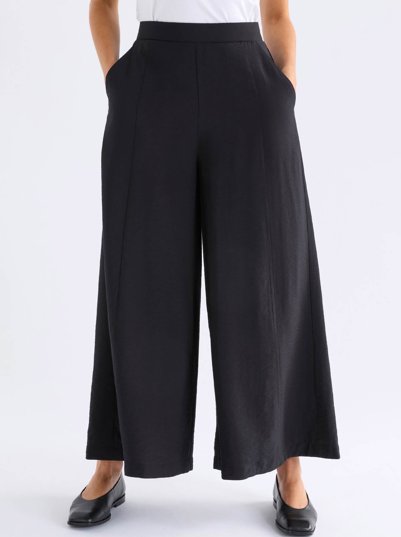 Image of a model wearing Pants. Product name - Elk Rema Pant in Black colour by brand - Elk