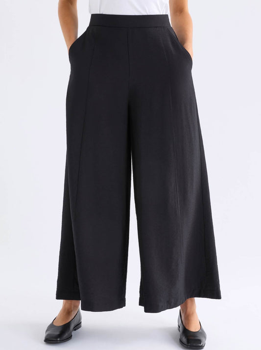 Image of a model wearing Pants. Product name - Elk Rema Pant in Black colour by brand - Elk