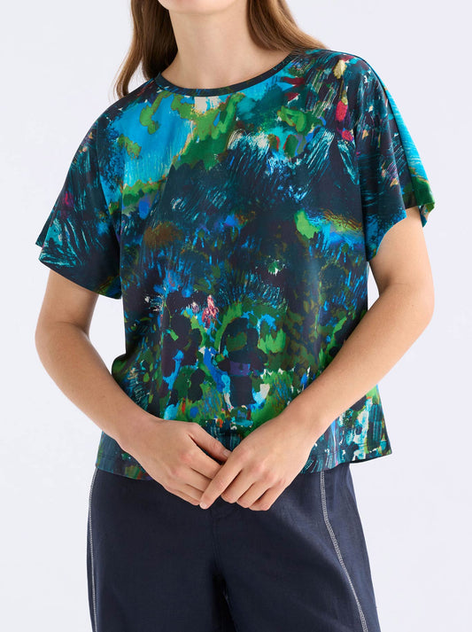 Image of a model wearing Tops. Product name - Elk Haki Short Sleeve Tee in Landskap Night colour by brand - Elk