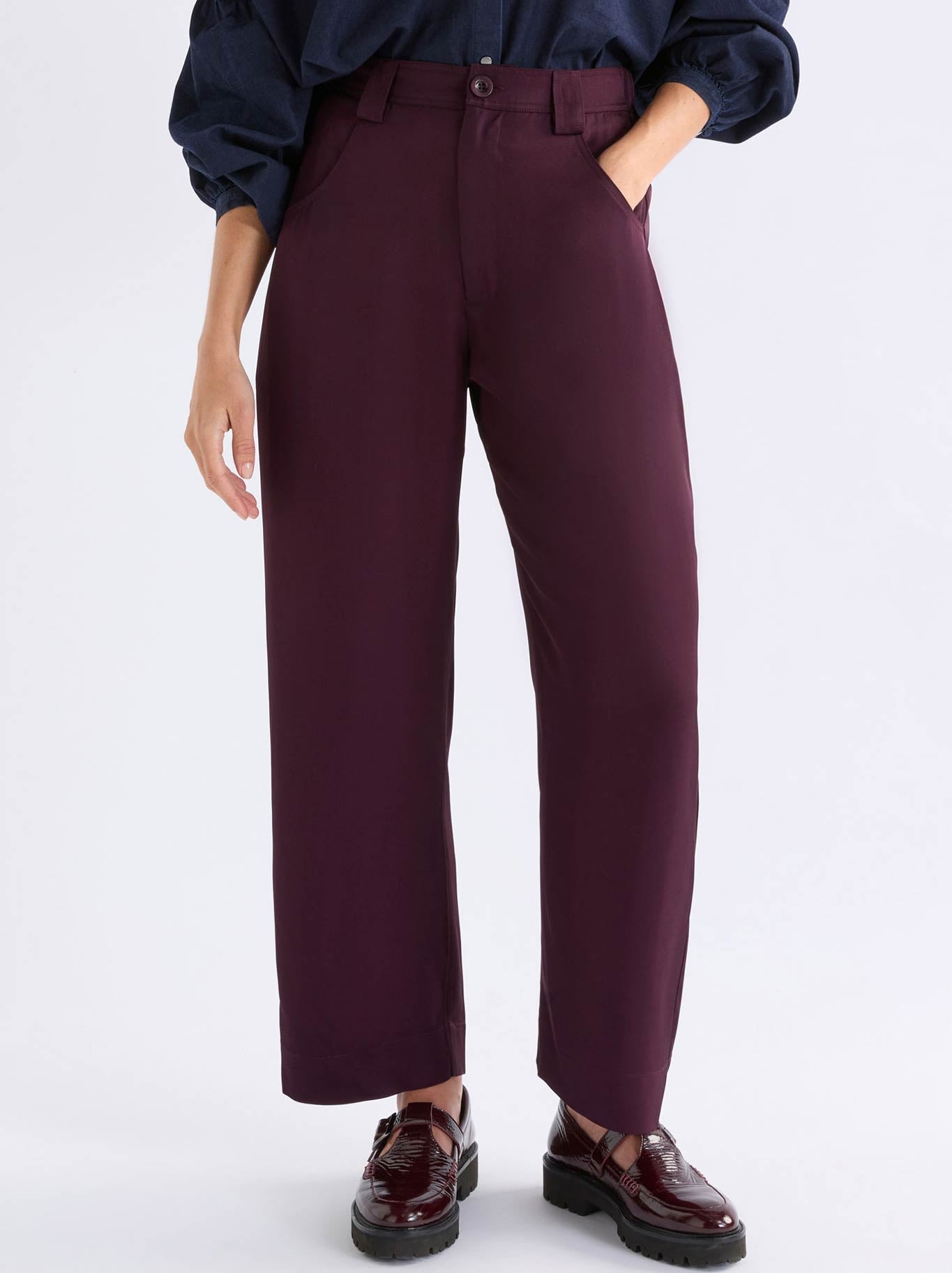 Image of a model wearing Pants. Product name - Elk Hullu Pant in Shiraz colour by brand - Elk