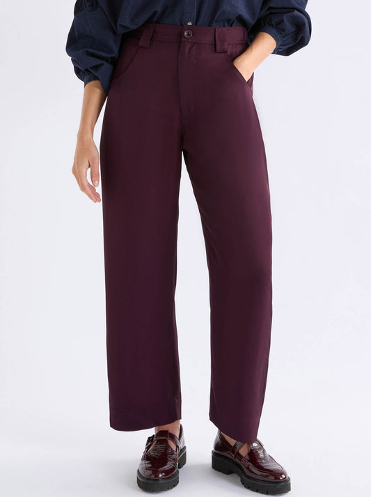 Image of a model wearing Pants. Product name - Elk Hullu Pant in Shiraz colour by brand - Elk