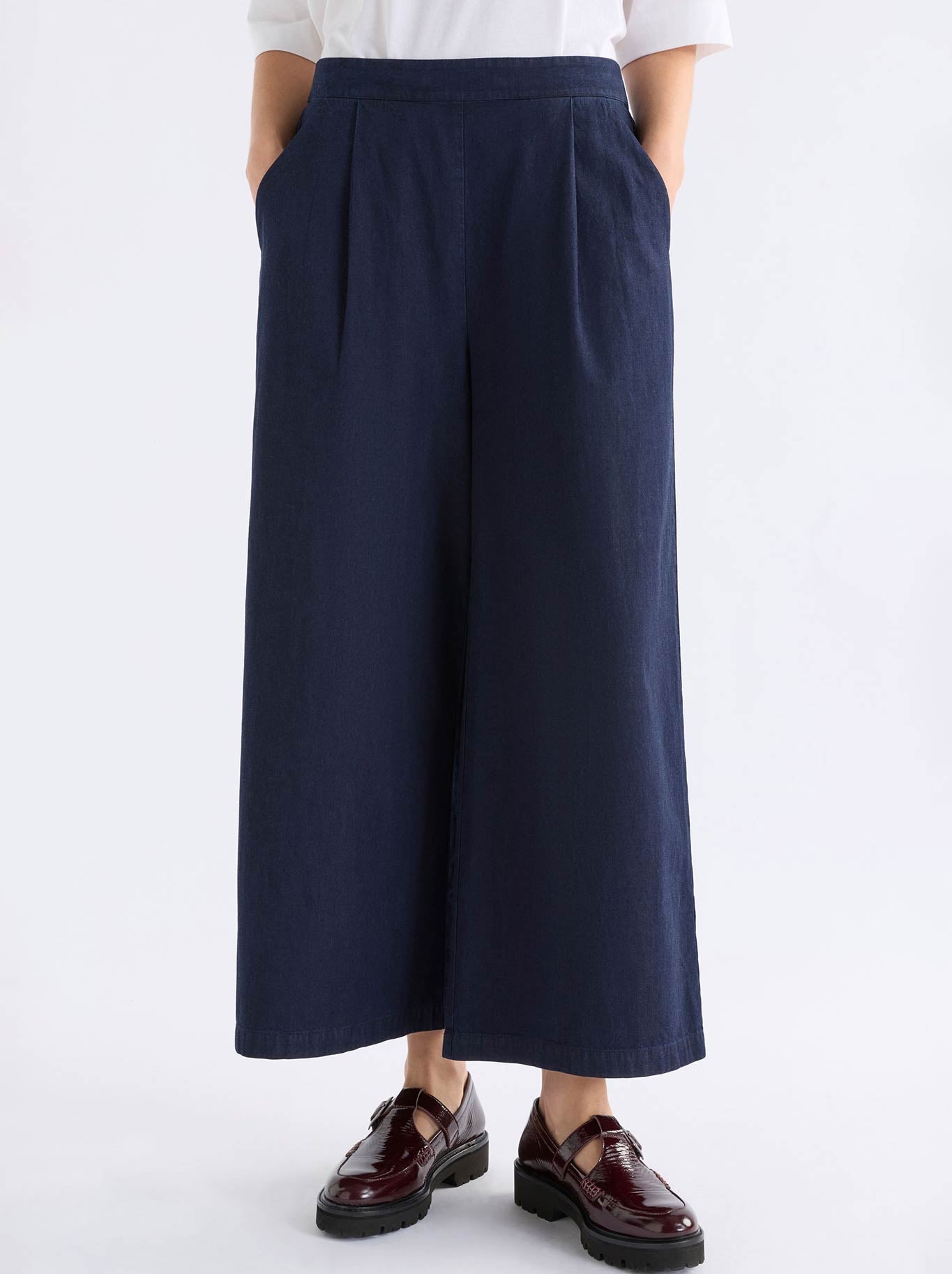 Image of a model wearing Pants. Product name - Elk Albez Pant in Dark Blue Denim colour by brand - Elk