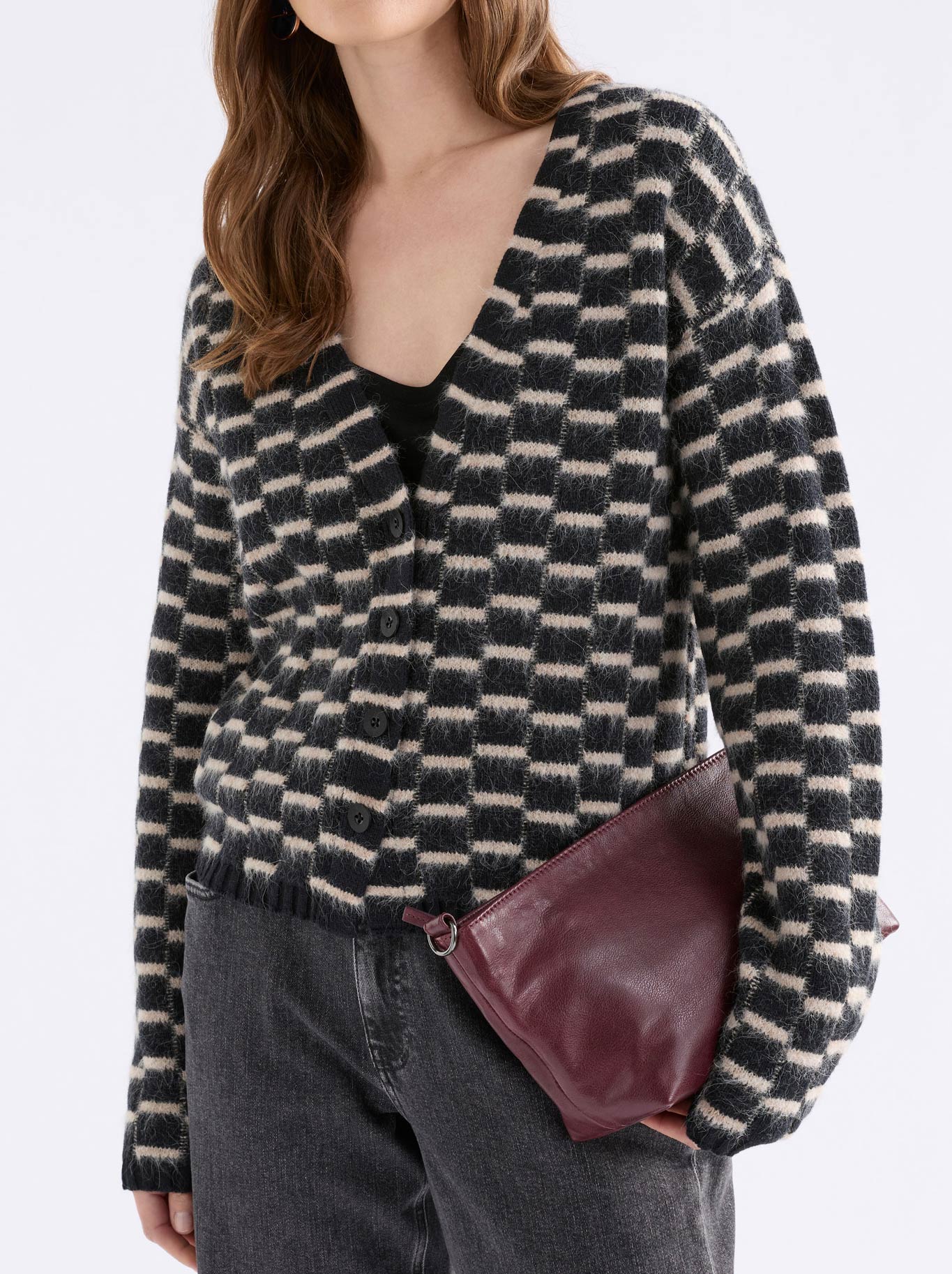 Image of a model wearing Outerwear. Product name - Elk Lunz Cardi in Black Beige colour by brand - Elk