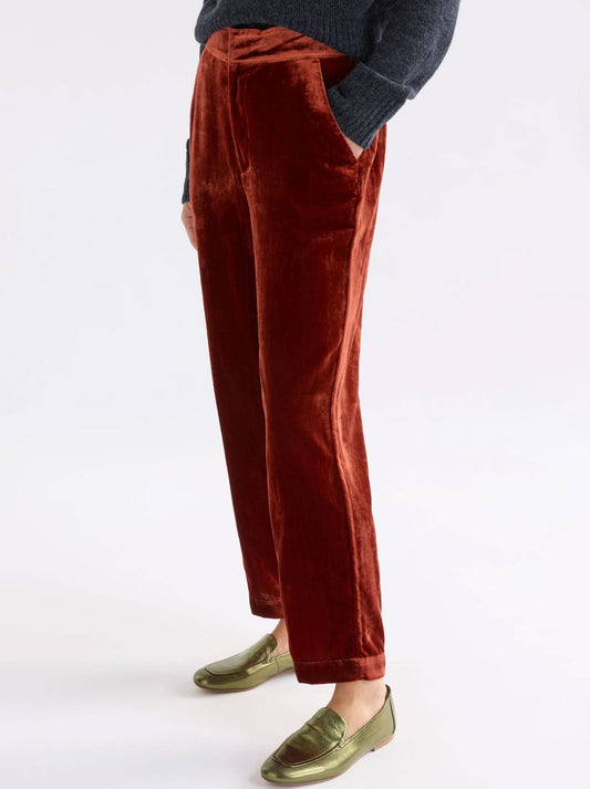 Image of a model wearing Pants. Productname: ELK SUURI VELVET PANT in Spice colour by brand - Elk