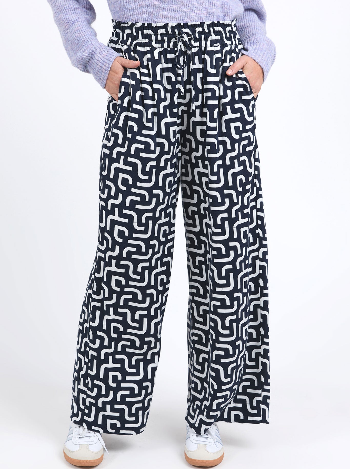 Image of a model wearing Pants. Productname: ELM GEMMA GEO PANT in Geo colour by brand - Elm