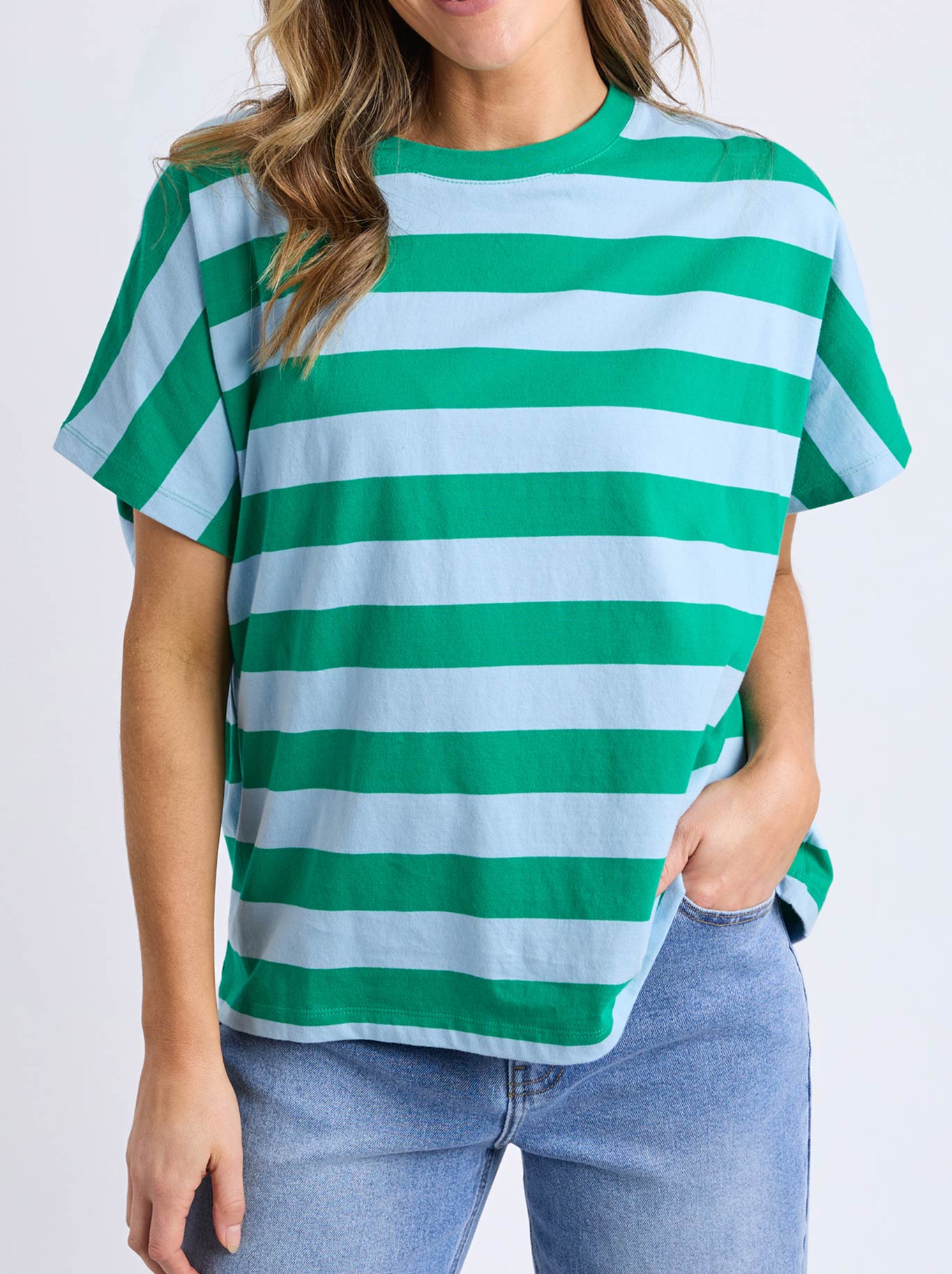Image of a model wearing Tops. Product name - Elm Poet Tee in Spring Green colour by brand - Elm