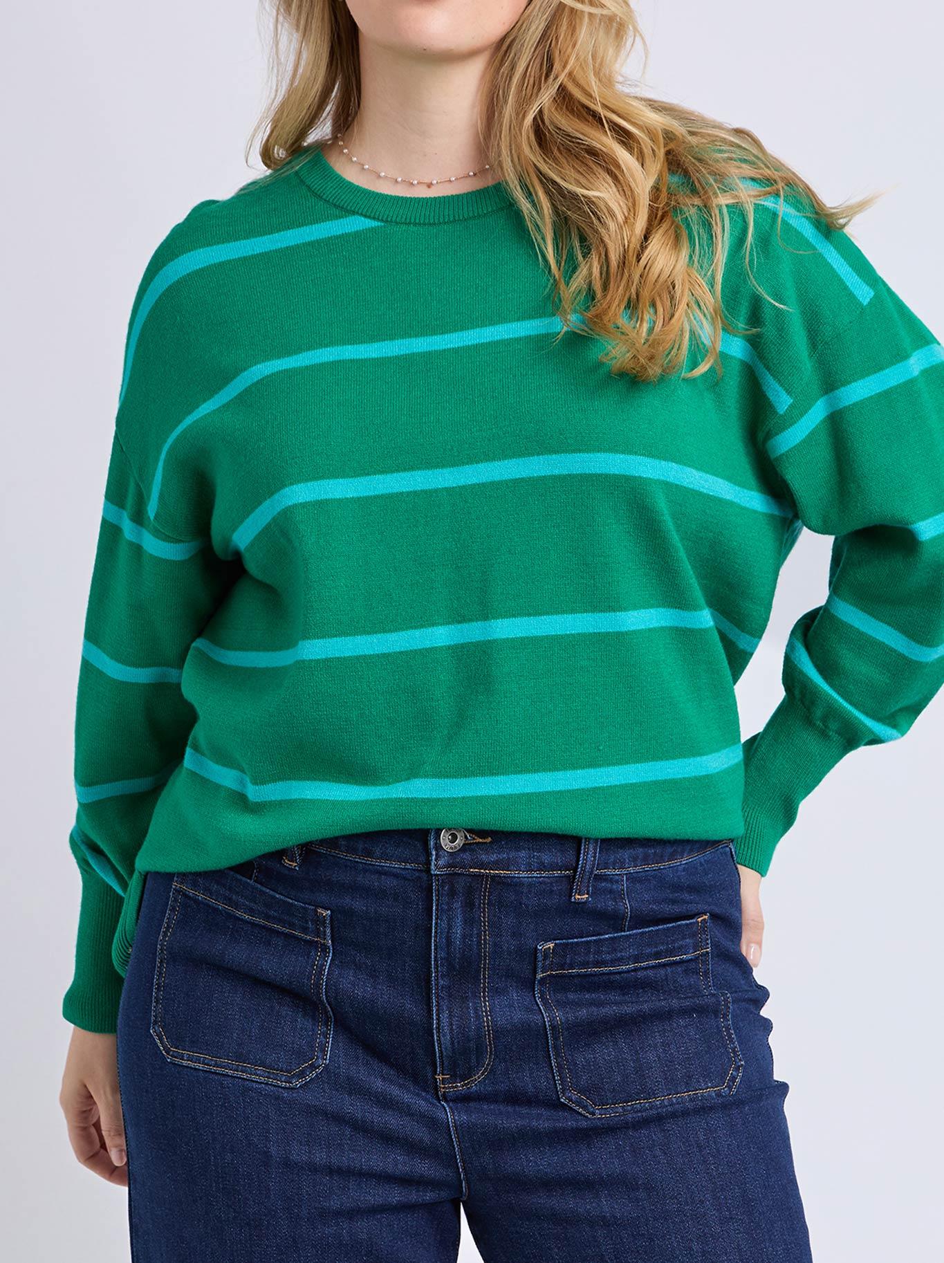 Image of a model wearing Outerwear. Product name - Elm Charlie Stripe Knit in Virdis Green colour by brand - Elm