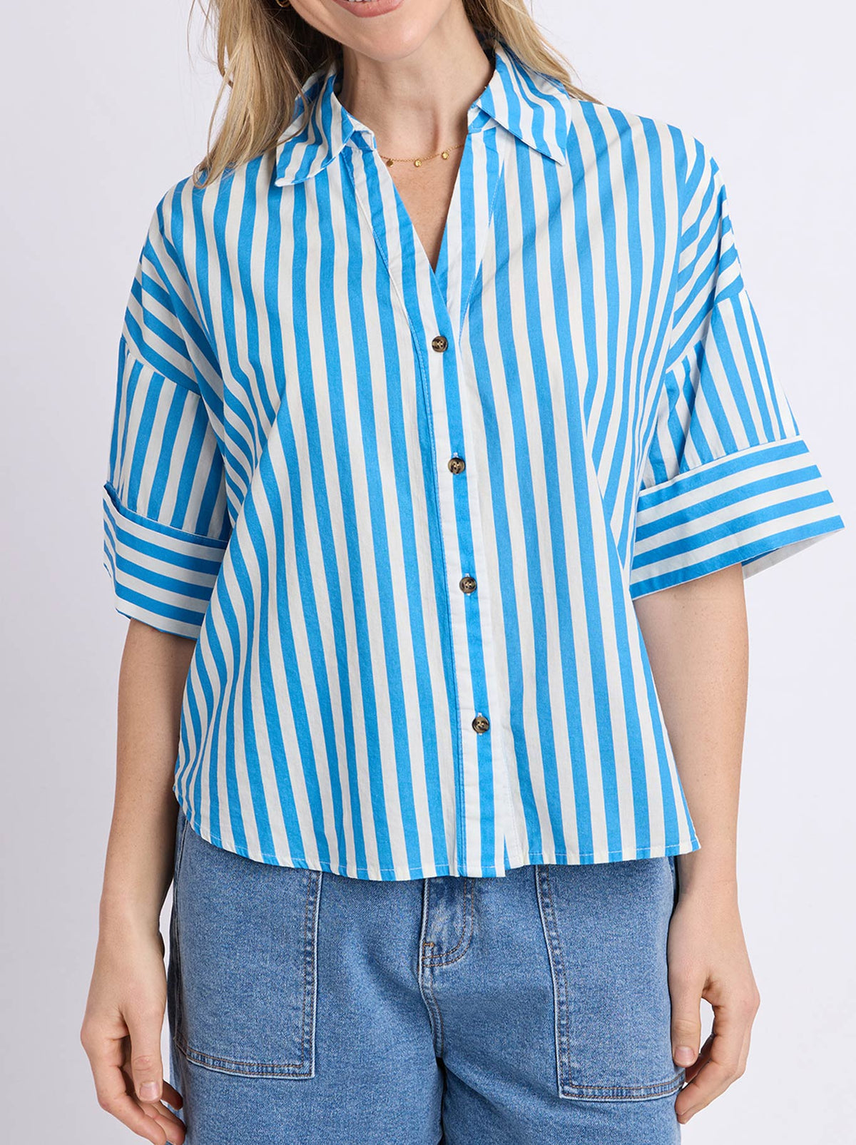Image of a model wearing Tops. Product name - Elm Striped Holiday Shirt in Azure White colour by brand - Elm