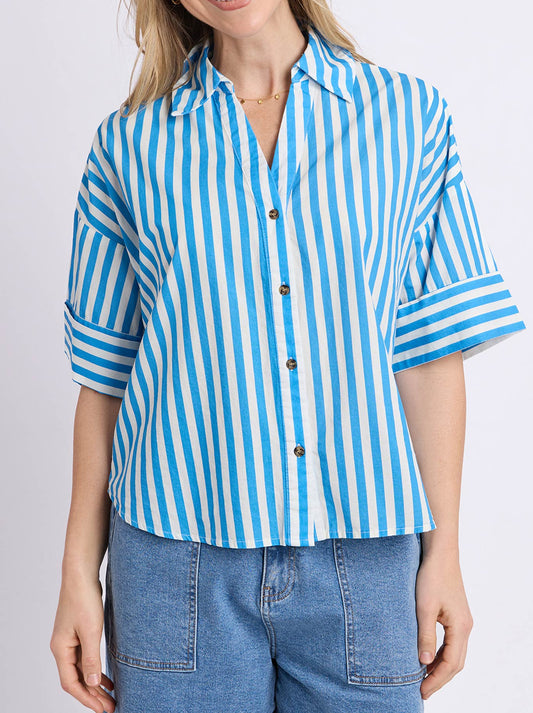 Image of a model wearing Tops. Product name - Elm Striped Holiday Shirt in Azure White colour by brand - Elm