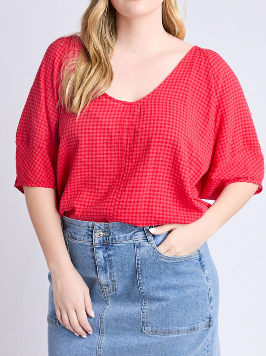 Image of a model wearing Tops. Productname: Elm Grove Top in Poppy colour by brand - Elm