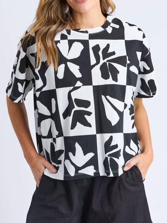 Image of a model wearing Tops. Productname: ELM SPLICE TEE in Black White colour by brand - Elm