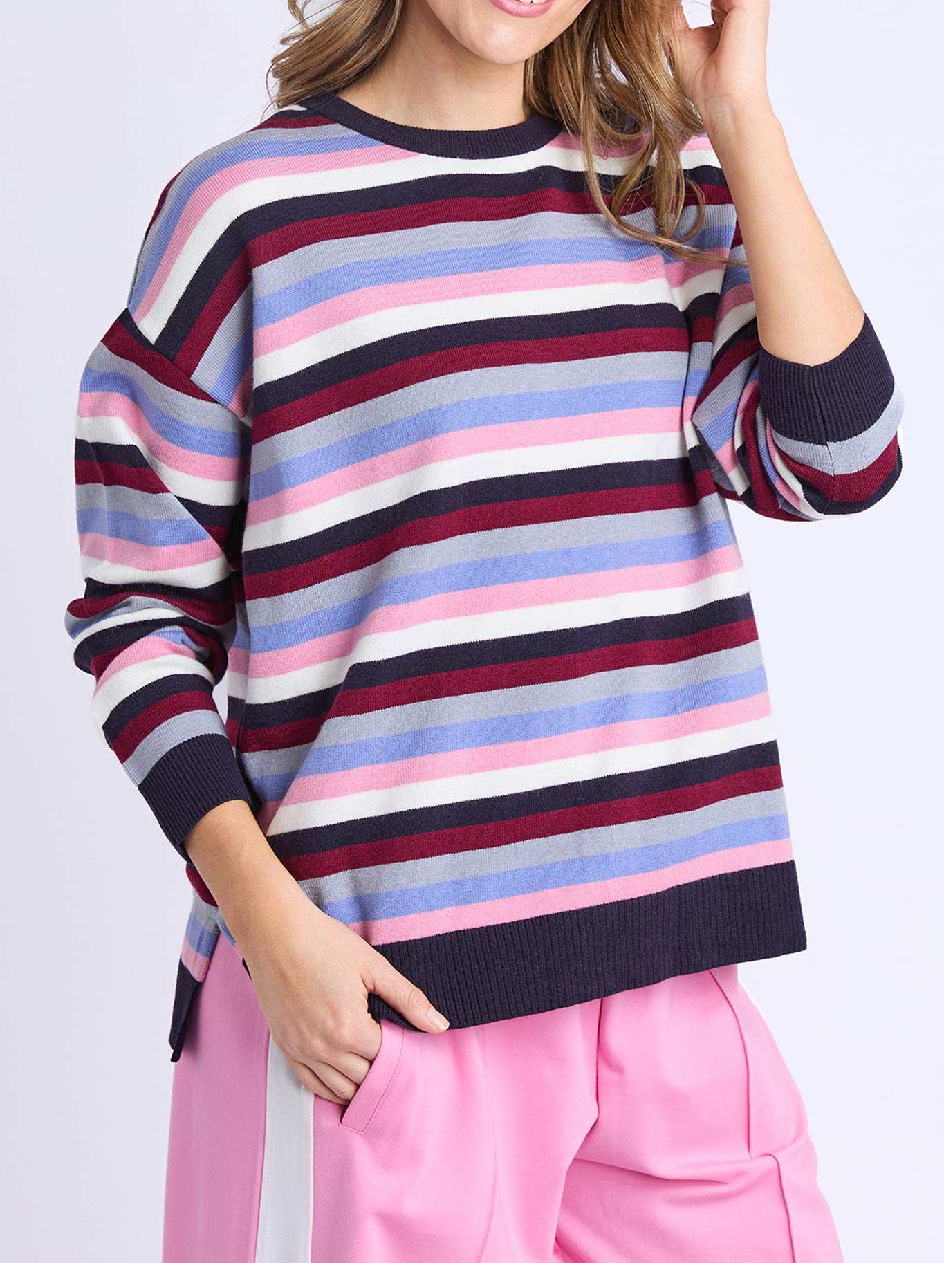 Image of a model wearing Outerwear. Product name - ELM LINEA STRIPE KNIT in Multi colour by brand - Elm