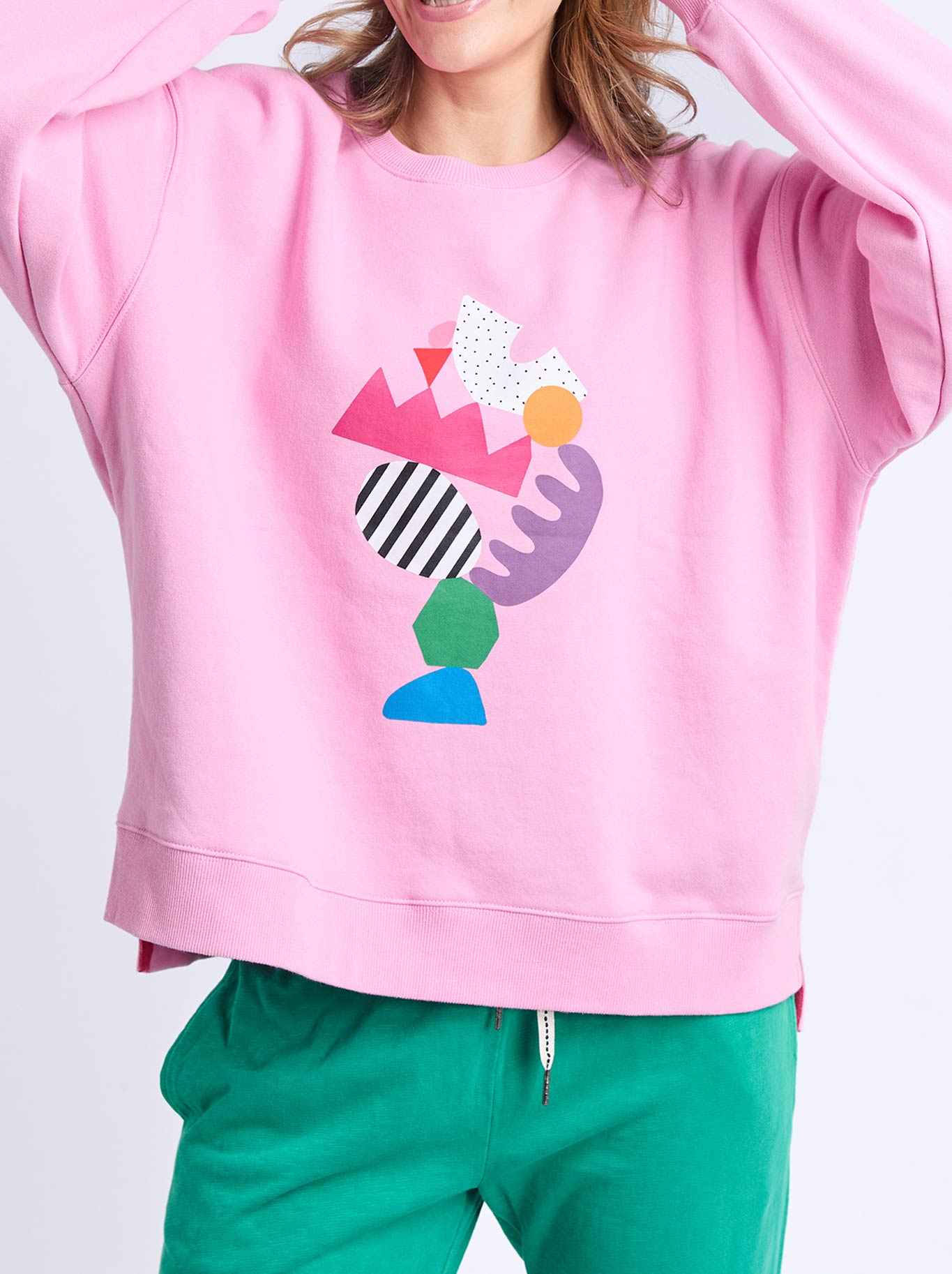 Image of a model wearing Tops. Product name - Elm Deb Mcnaughton Crew in Pretty Pink colour by brand - Elm
