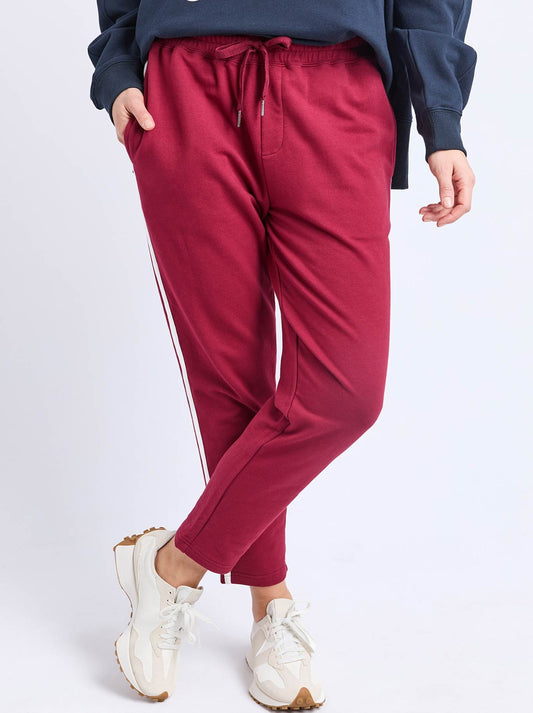Image of a model wearing Pants. Product name - Elm Sigrid Lounge Pant in Maroon colour by brand - Elm