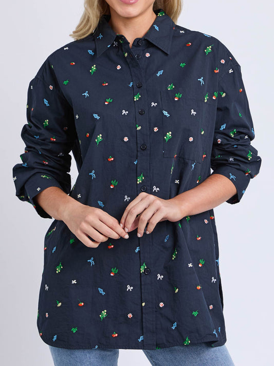Image of a model wearing Tops. Product name - ELM MARKET PICK SHIRT in Navy Print colour by brand - Elm