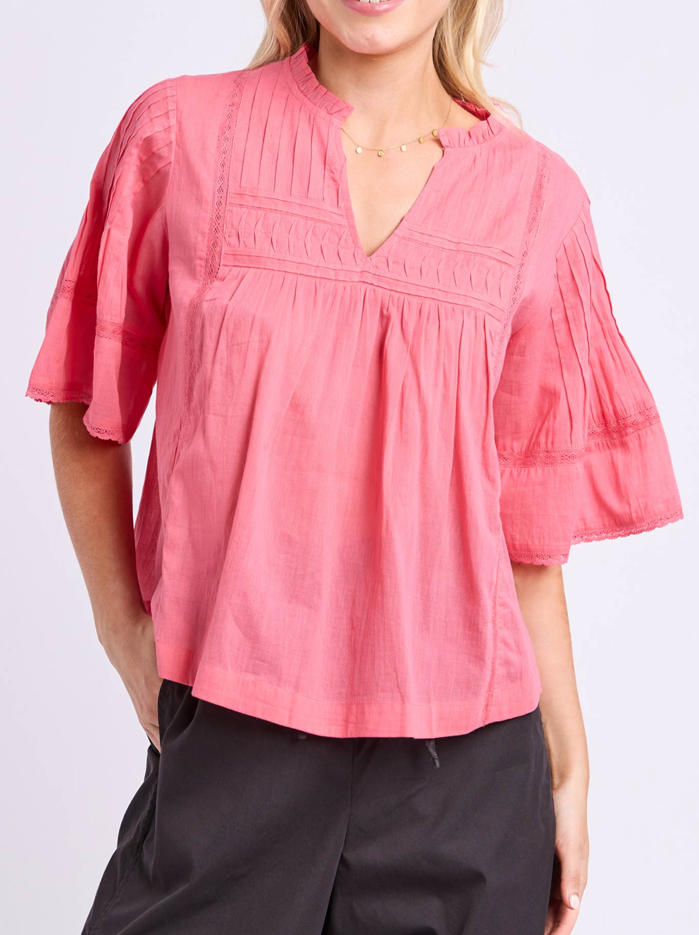 Image of a model wearing Tops. Product name - ELM ROSEWOOD TOP in Pink Lemonade colour by brand - Elm