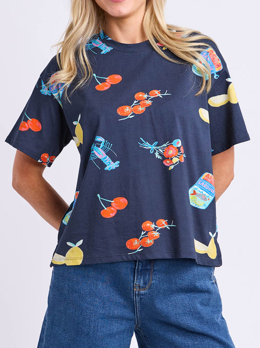 Image of a model wearing Tops. Product name - ELM MARKET TEE in Navy colour by brand - Elm