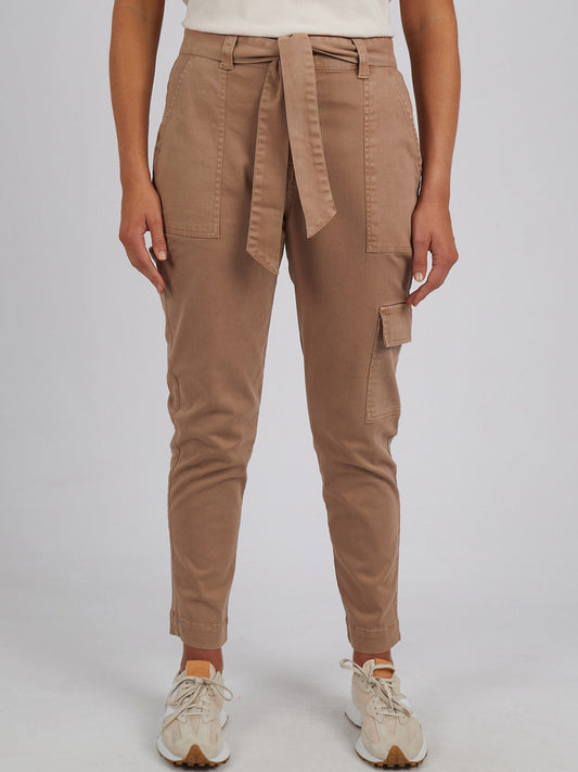 Image of a model wearing Pants. Productname: ELM DAHLIA CARGO PANT in Mocha colour by brand - Elm