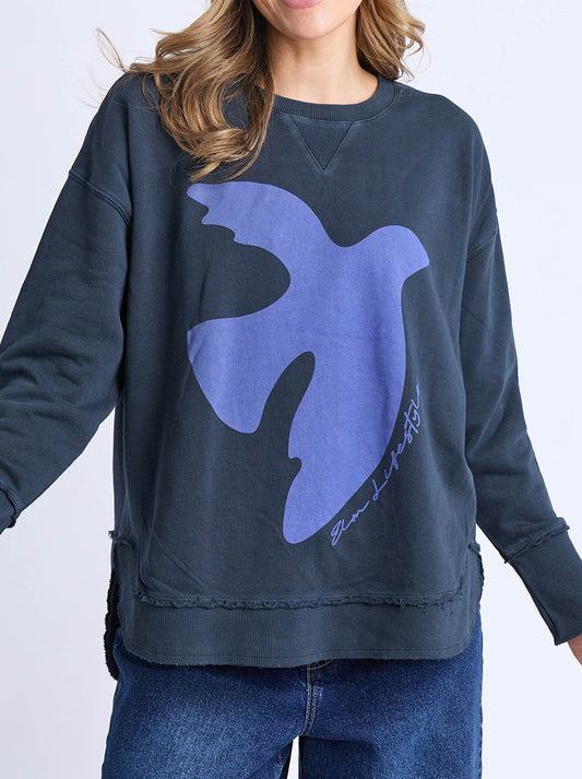 Image of a model wearing Tops. Product name - ELM LOVIISA CREW in Navy colour by brand - Elm