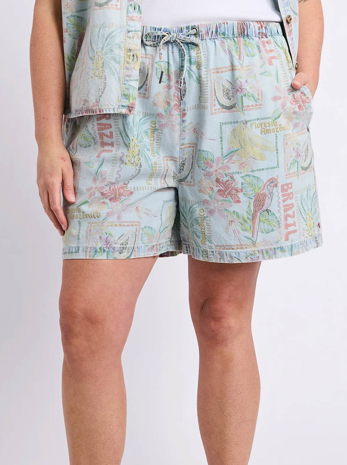 Image of a model wearing Shorts. Product name - ELM JADE PRINTED DENIM SHORT in Print colour by brand - Elm