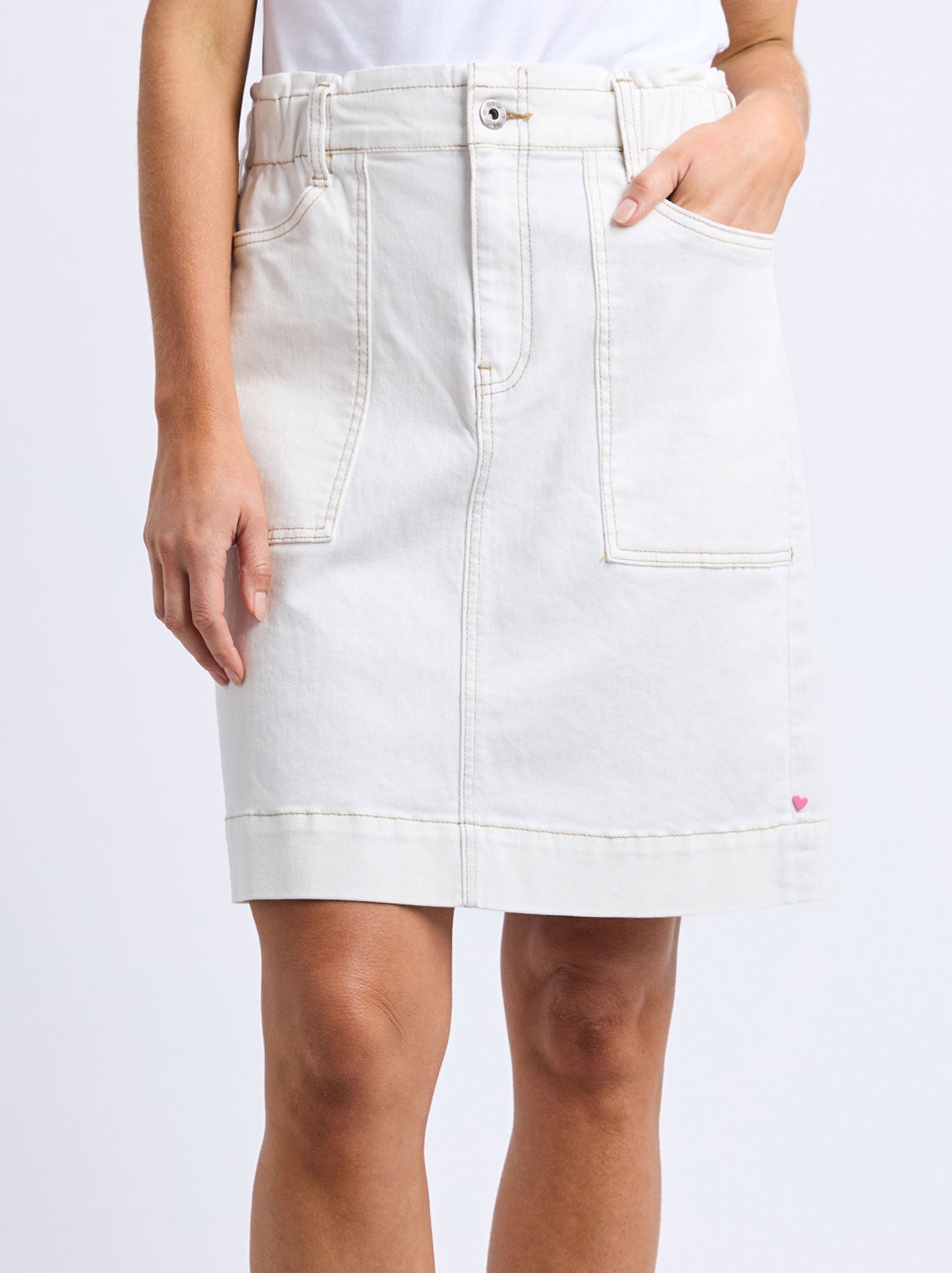 Image of a model wearing Skirts. Productname: ELM ATLAS DENIM SKIRT in White colour by brand - Elm