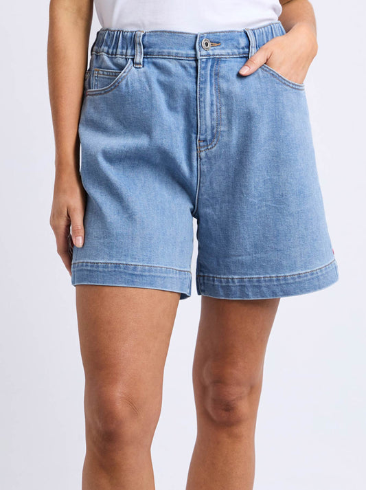 Image of a model wearing Shorts. Product name - ELM BIRDIE DENIM SHORT in Lightwash colour by brand - Elm