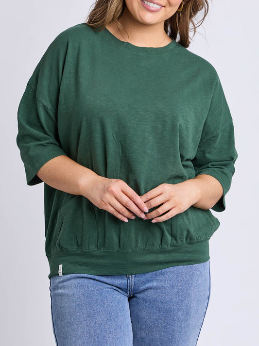 Image of a model wearing Tops. Product name - Elm Mazie Sweat in Winter Green colour by brand - Elm