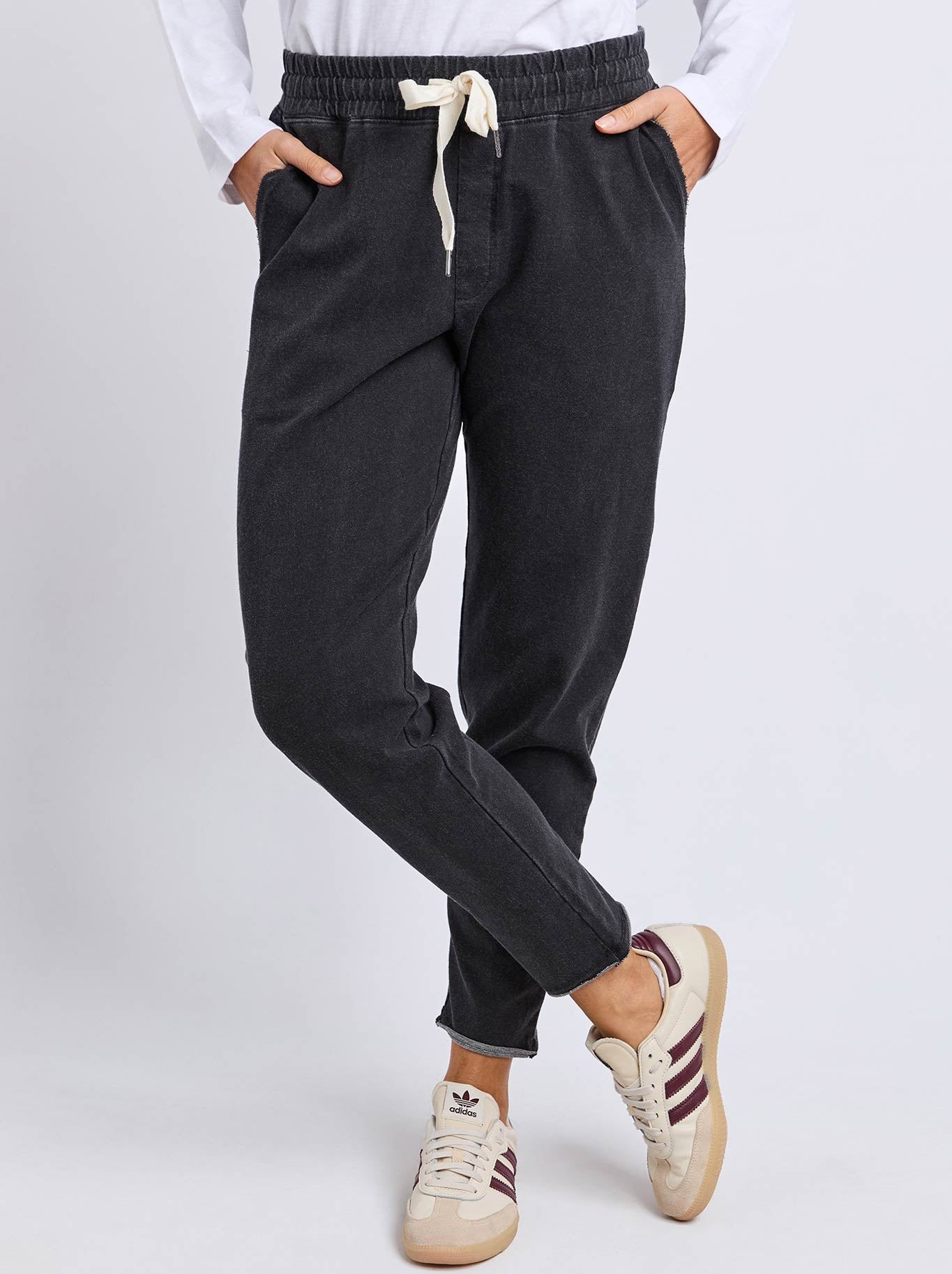 Image of a model wearing Pants. Product name - Elm Rickety Pant in Black colour by brand - Elm