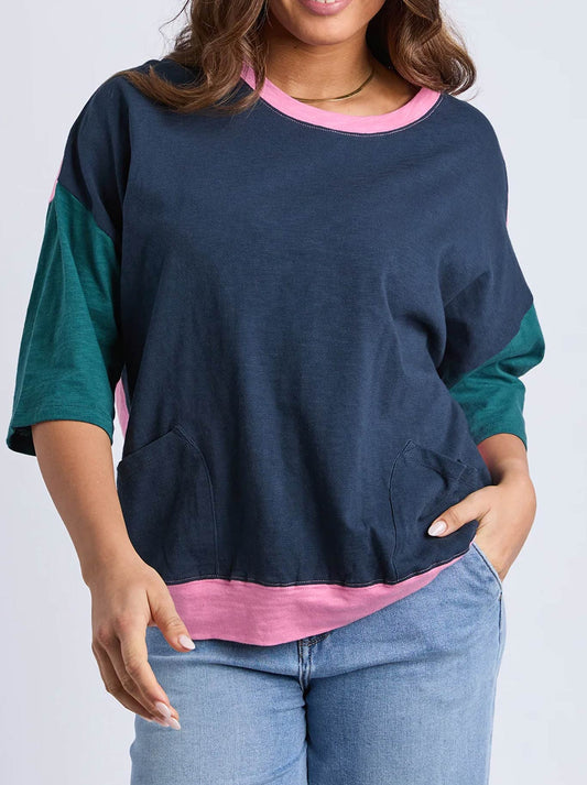 Image of a model wearing Tops. Product name - Elm Mazie Colour Block Sweat in Teal/Navy Stripe colour by brand - Elm