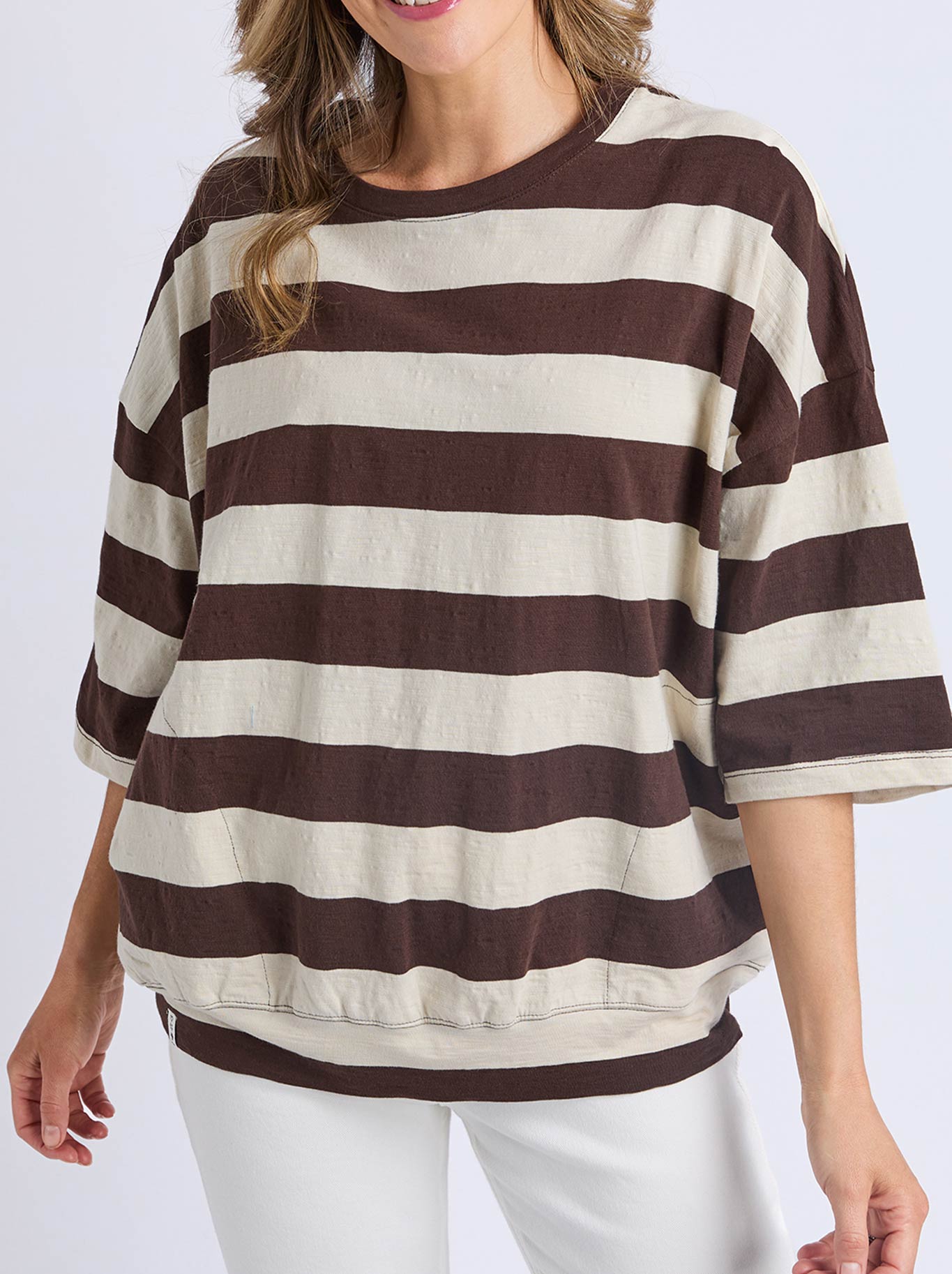 Image of a model wearing Tops. Product name - ELM MAZIE BLOCK STRIPE SWEAT in Coffee colour by brand - Elm