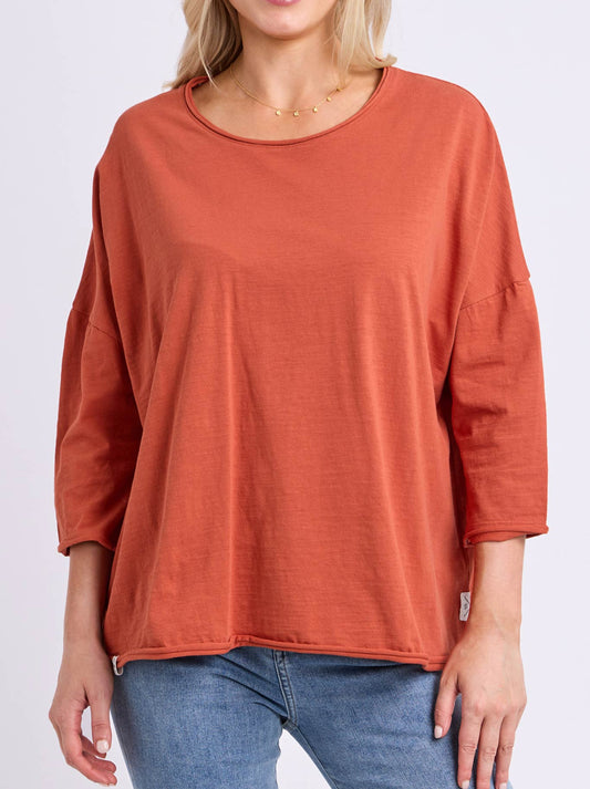 Image of a model wearing Tops. Product name - ELM ANYA TOP in Earth colour by brand - Elm
