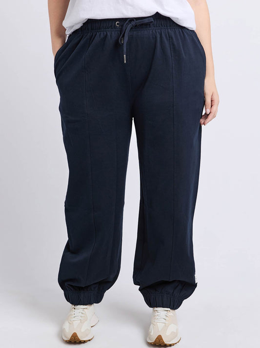 Image of a model wearing Pants. Productname: Elm Aubrey Trackpant in Dark Sapphire colour by brand - Elm