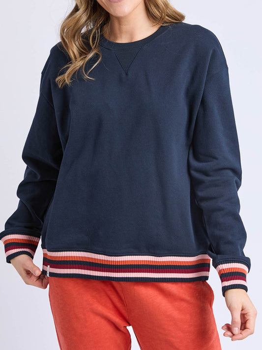 Image of a model wearing Tops. Product name - Elm Lili Fleece Crew in Navy colour by brand - Elm