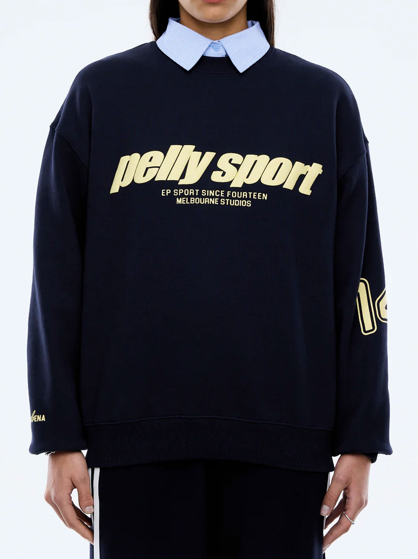 Image of a model wearing Outerwear. Productname: ENA PELLY ENA SPORTS SWEATER in Navy colour by brand - Ena Pelly