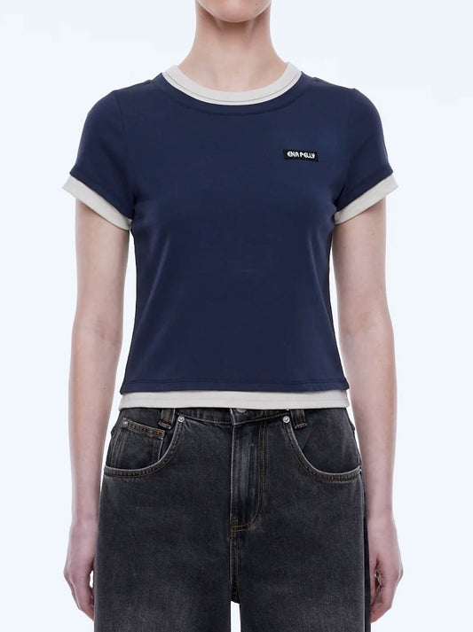 Image of a model wearing Tops. Product name - ENA PELLY LENNY TEE in Navy/ Beige colour by brand - Ena Pelly