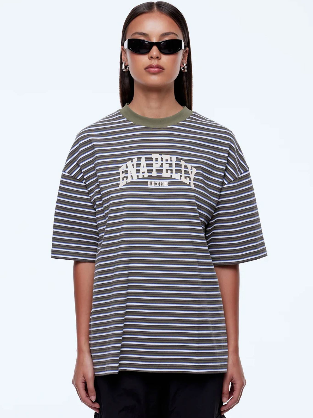 Image of a model wearing Tops. Product name - ENA PELLY MAEVE RELAXED TEE in Green Multi Stripe colour by brand - Ena Pelly