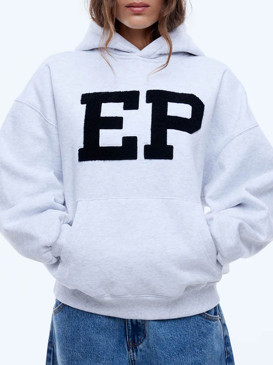 Image of a model wearing Outerwear. Productname: ENA PELLY EP HOODIE in White/Marl colour by brand - Ena Pelly