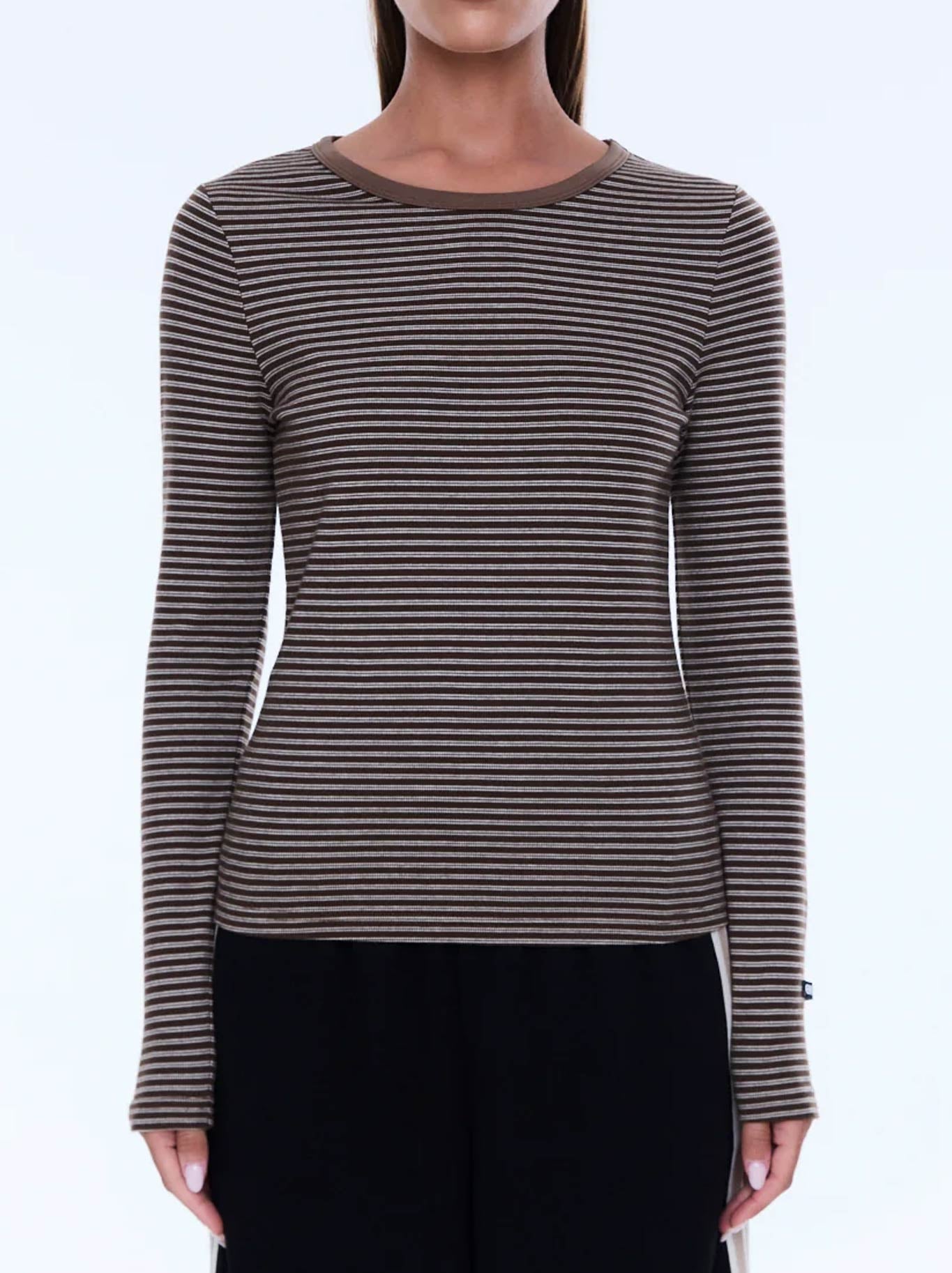 Image of a model wearing Tops. Product name - ENA PELLY PIPER LONG SLEEVE STRIPE TOP in Sand colour by brand - Ena Pelly