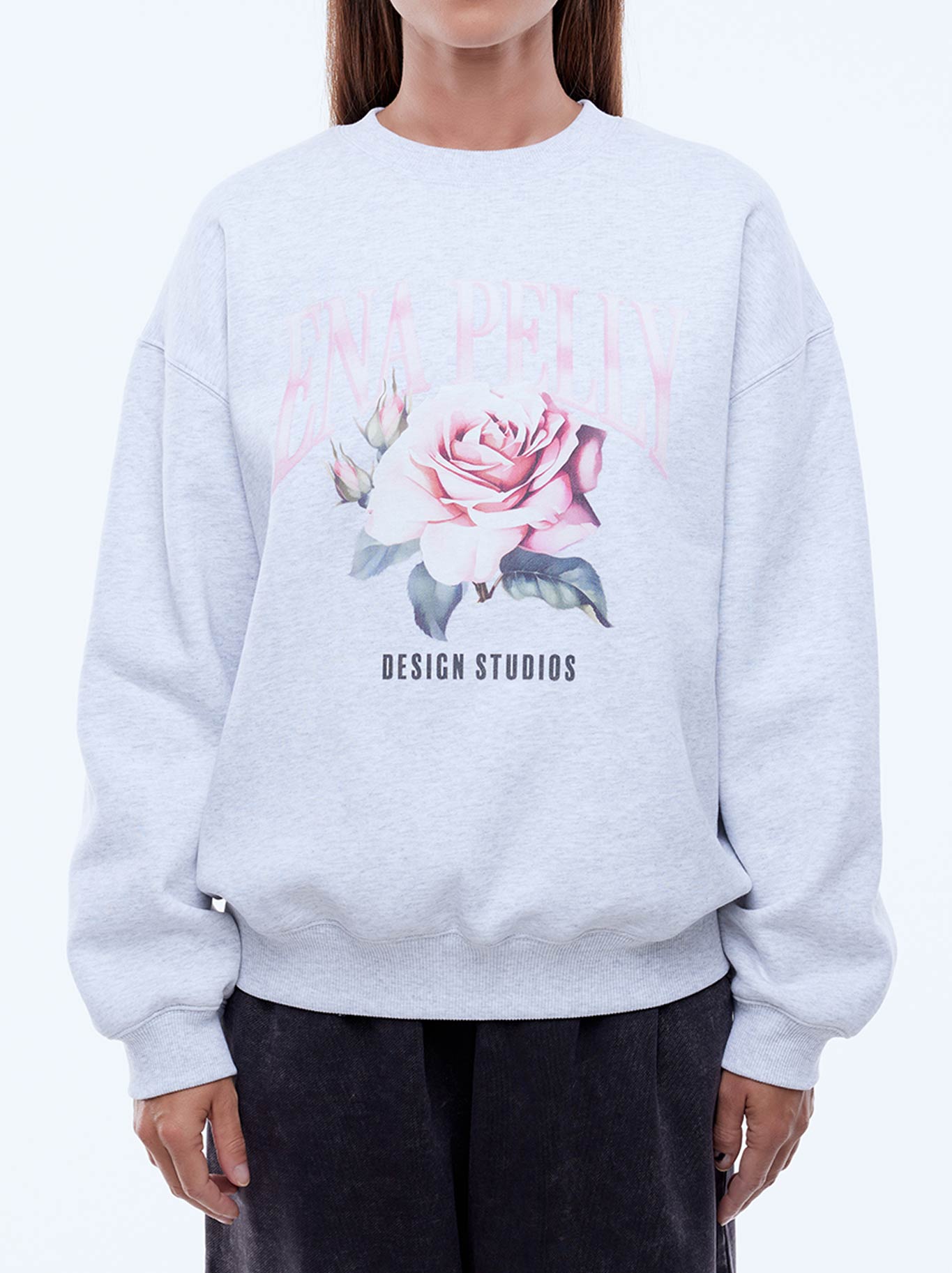 Image of a model wearing Tops. Productname: ENA PELLY ROSE SWEATSHIRT in White/Marl colour by brand - Ena Pelly