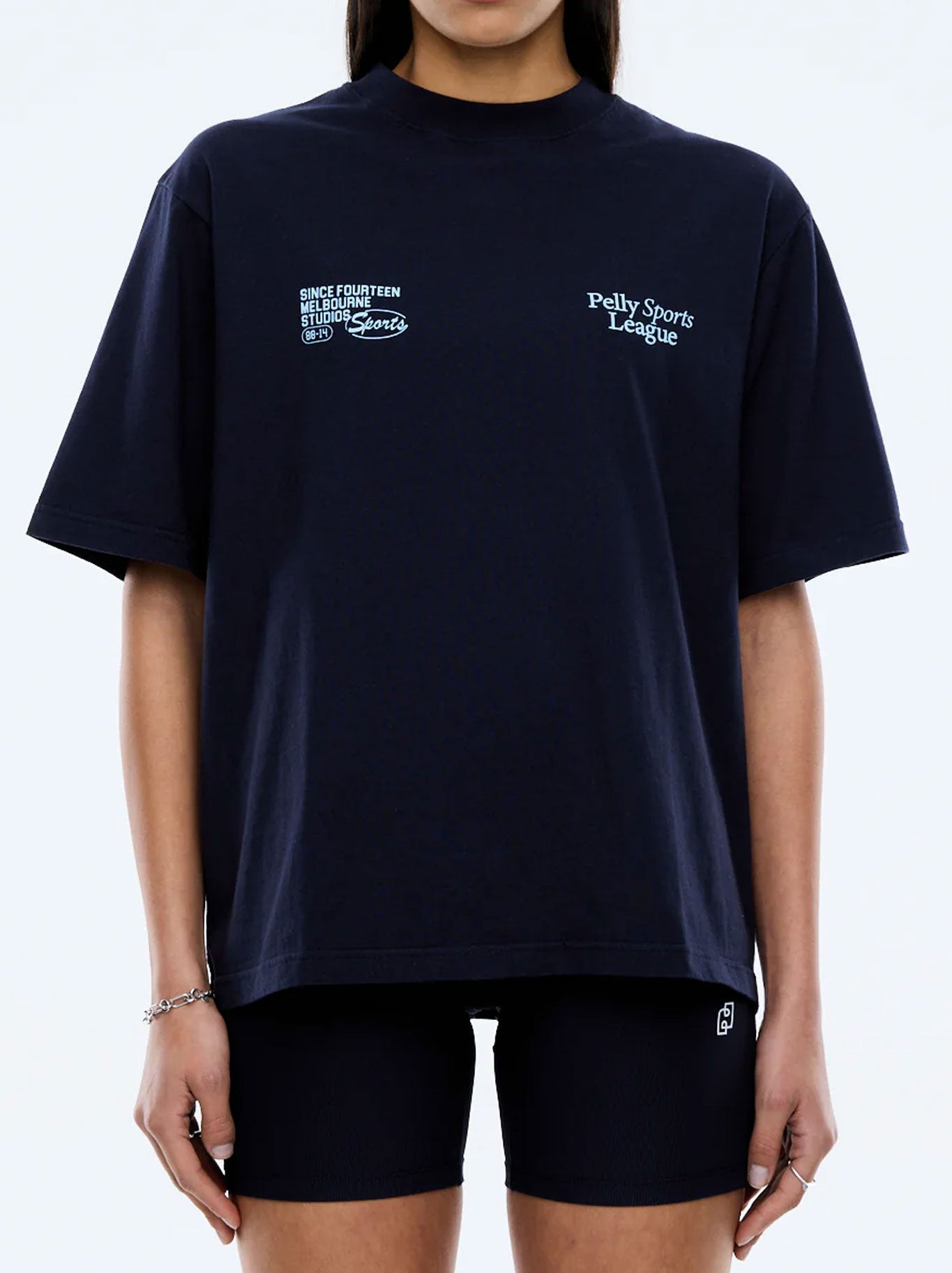 Image of a model wearing Tops. Productname: ENA PELLY SPORTS LEAGUE TEE in Navy colour by brand - Ena Pelly