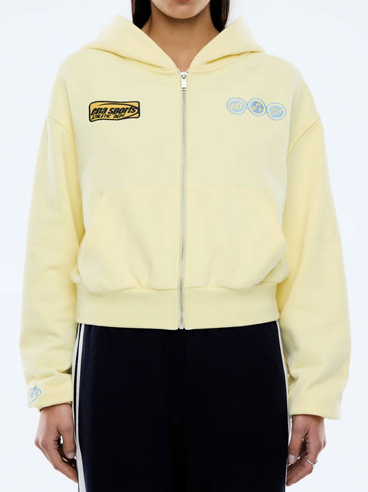 Image of a model wearing Outerwear. Productname: ENA PELLY SPORTS ZIP THROUGH HOODIE in Lemon colour by brand - Ena Pelly