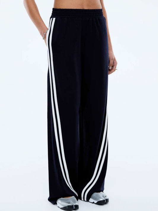 Image of a model wearing Pants. Productname: ENA PELLY VALENTINA STRIPE PANT in Black White colour by brand - Ena Pelly