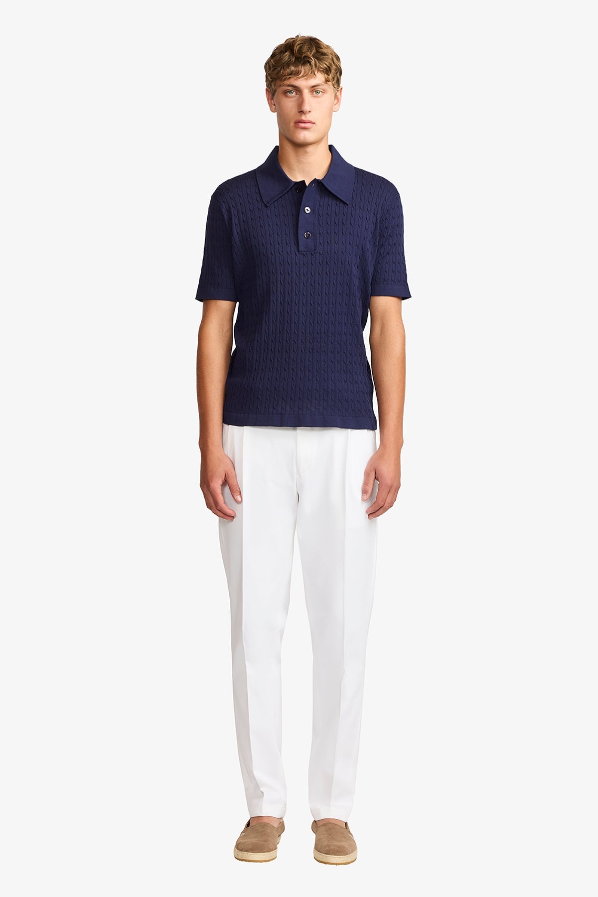 Image of a model wearing Tops. Productname: Anthony Squires Evan navy knitted cable Polo in Navy colour by brand - Anthony Squires