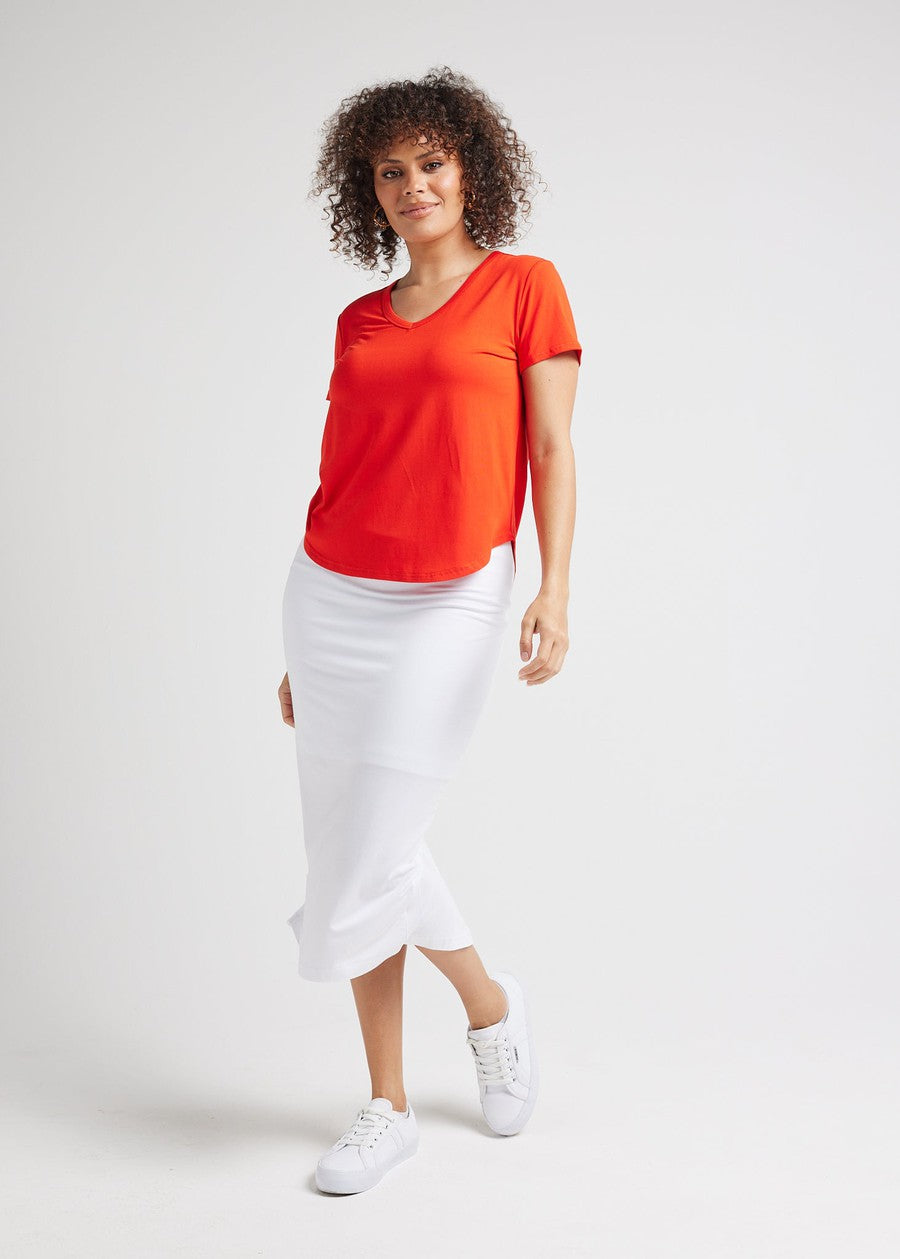 Image of a model wearing Tops. Product name - Veronica Bamboo V-Neck T-Shirt Fiery Red in Fiery Red colour by brand - Lou Lou