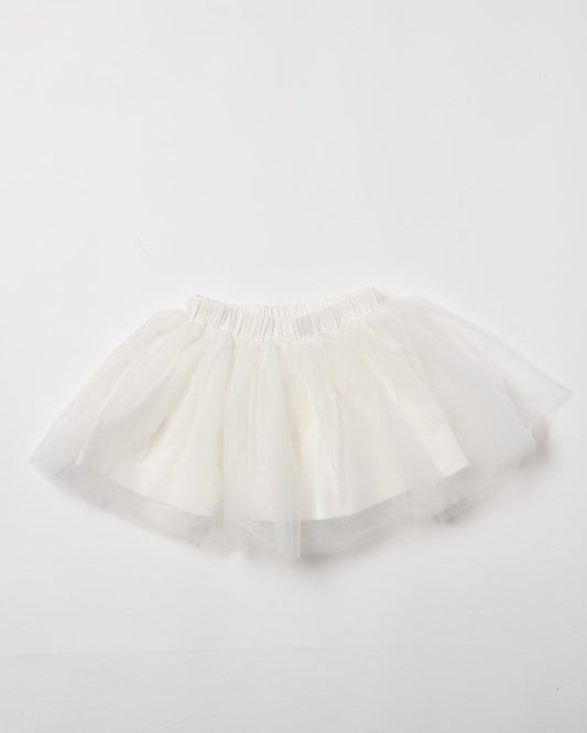 Image of a model wearing Skirts. Product name - Fairy Skirt in Ivory colour by brand - Walnut Melbourne