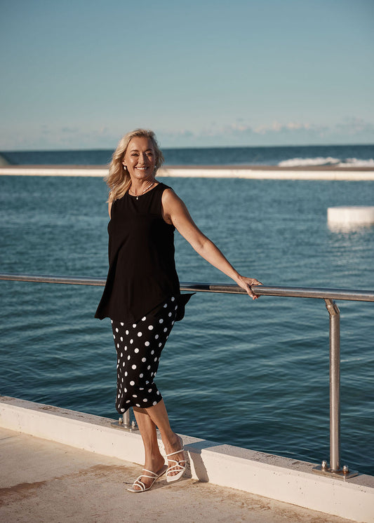 Image of a model wearing Skirts. Product name - Maxi Bamboo Whitney Tube Skirt Polka Dot in Polka Dot colour by brand - Lou Lou