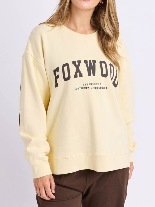 Image of a model wearing Tops. Product name - FOXWOOD INTERVAL CREW in Buttercream/Choc colour by brand - Foxwood