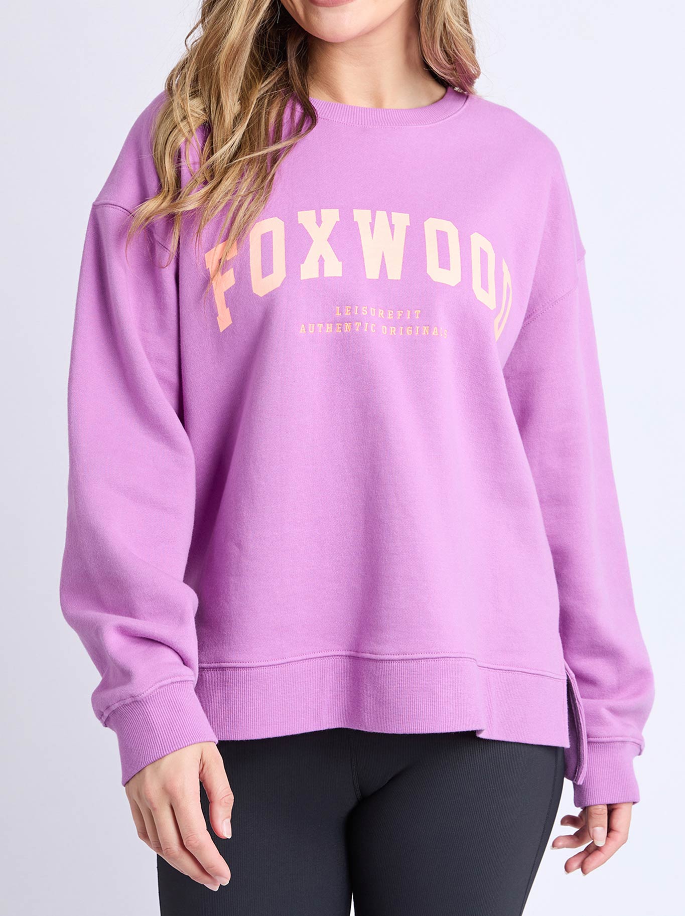 Image of a model wearing Tops. Product name - Foxwood Interval Crew in Purple Orange colour by brand - Foxwood