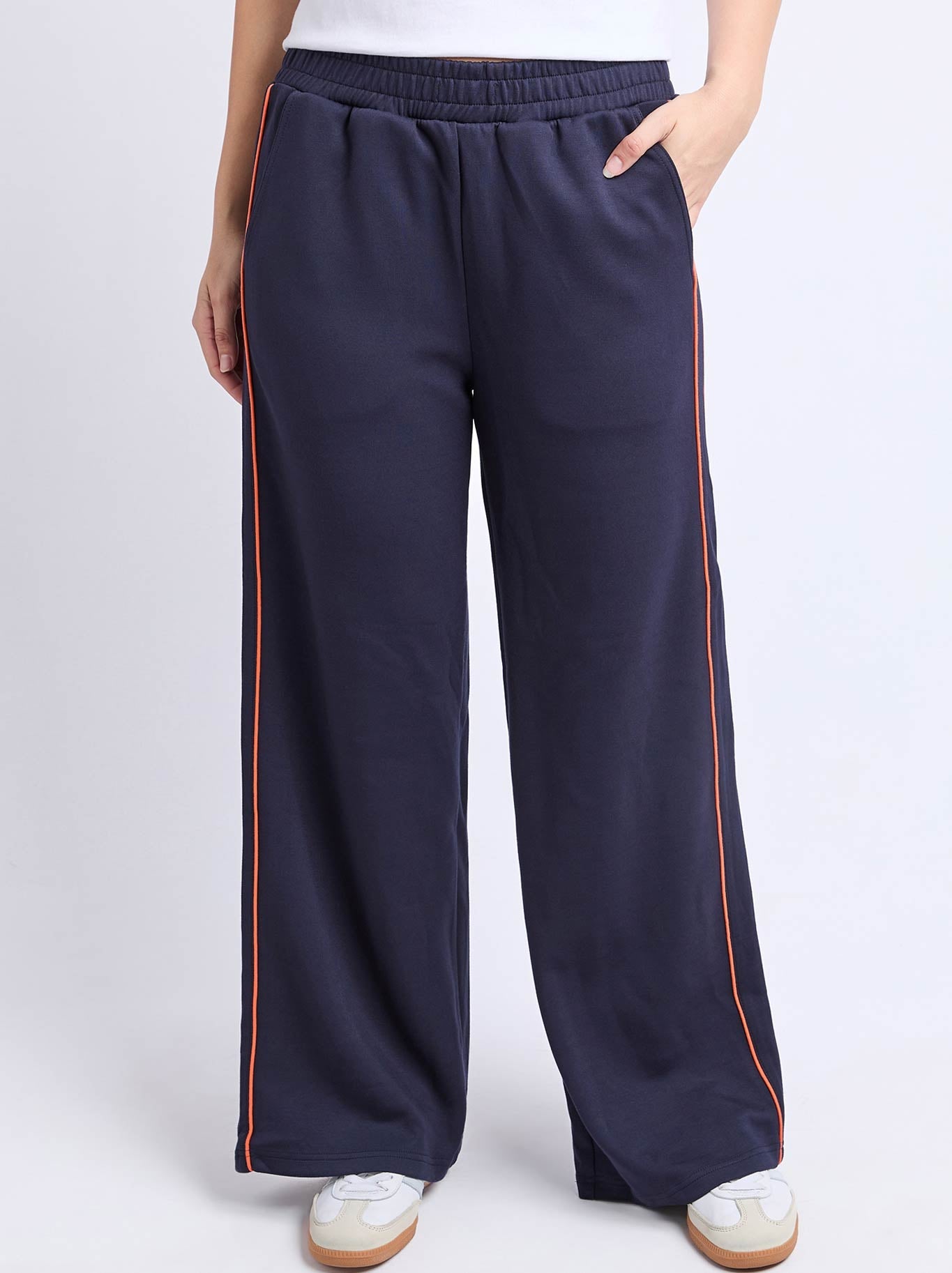 Image of a model wearing Pants. Product name - Foxwood Traveller Pant in Navy Orange colour by brand - Foxwood